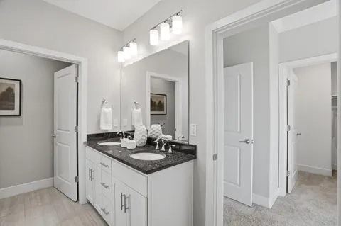 a kitchen with sink and cabinets