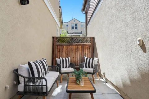 a view of balcony with furniture