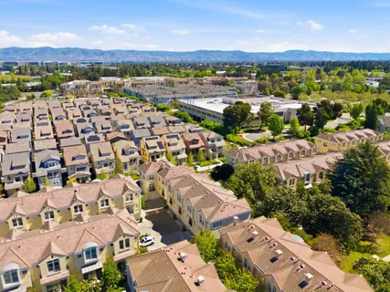 a view of a pathway both side of house