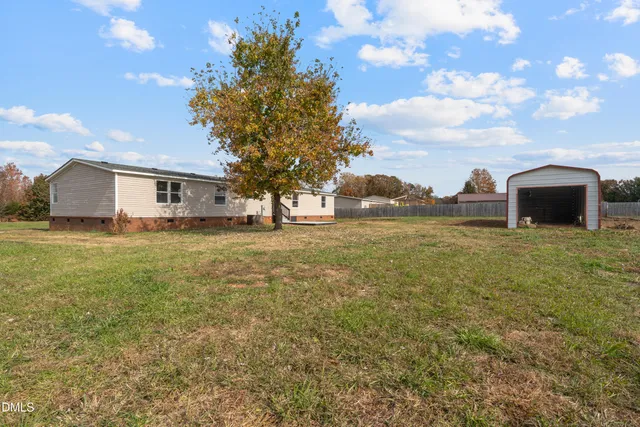 a view of a yard with an outdoor space and seating area
