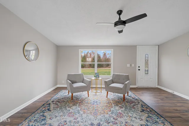a living room with furniture and a window