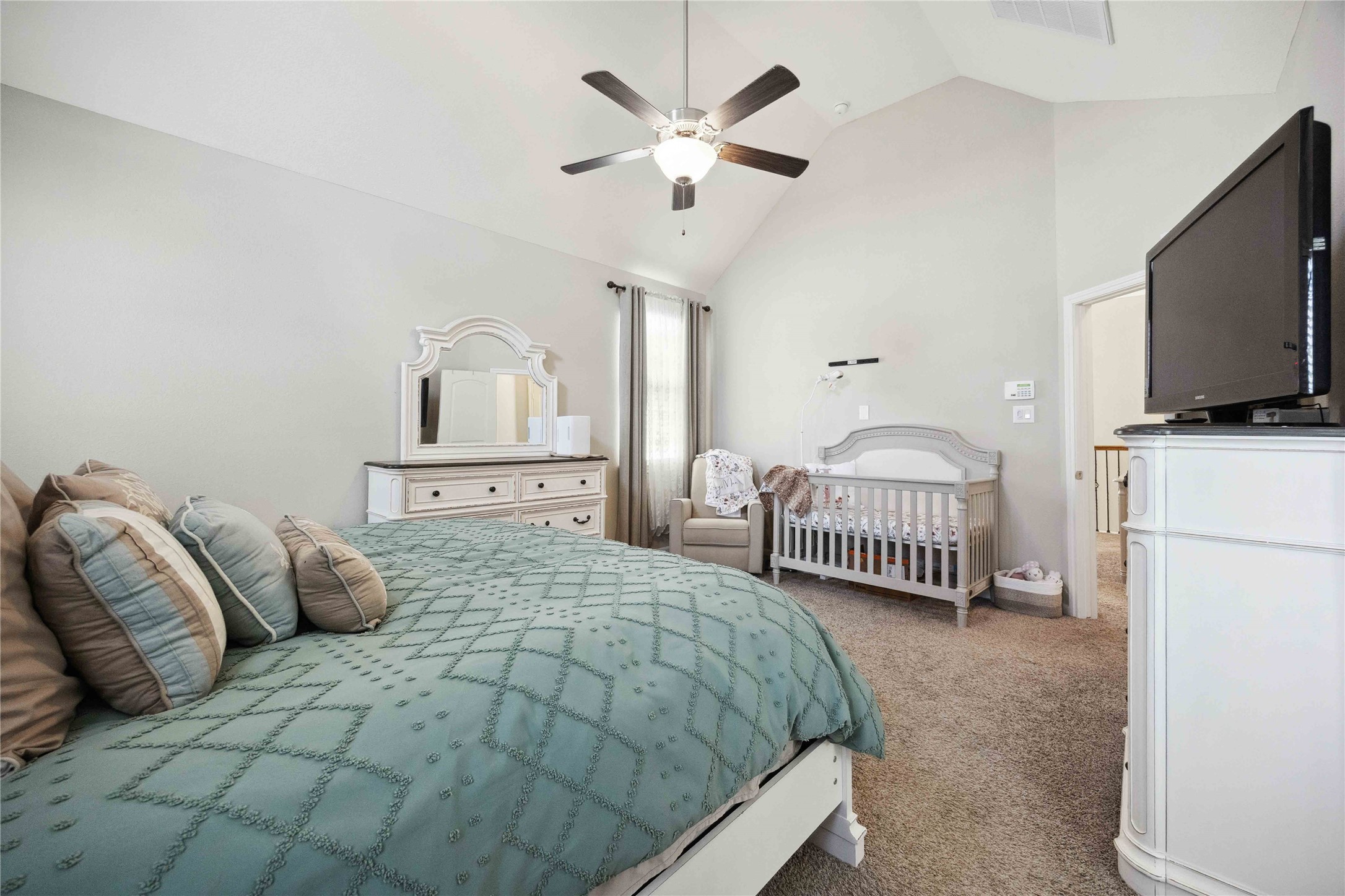 323 Biltmore Loop Montgomery, TX 77316 - Photo 19 of 27 Plenty of natural light enhances this inviting primary bedroom with en suite bath.