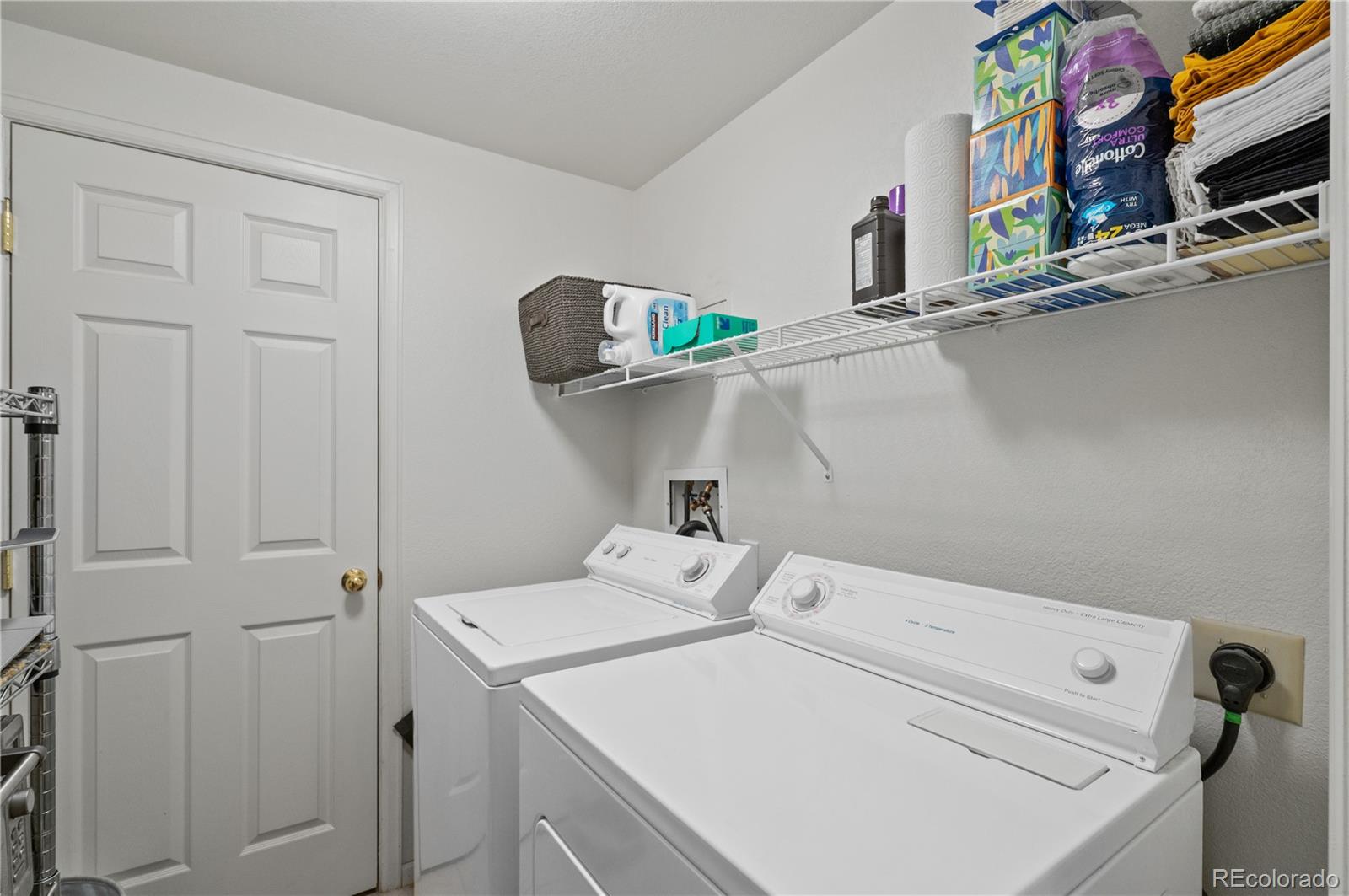 180 Cook Street, Unit 203 Denver, CO 80206 - Photo 32 of 44 a utility room with dryer and washer