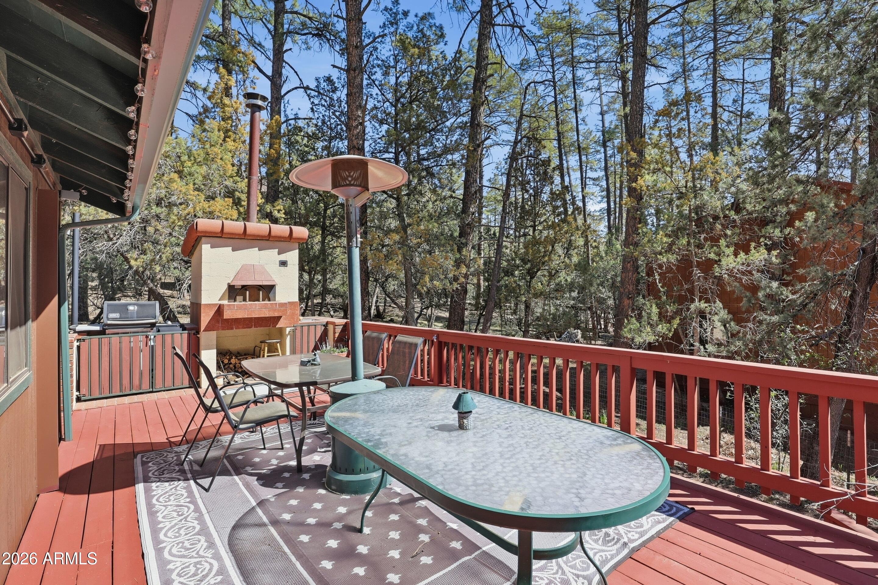 6740 Ridge Road Pine, AZ 85544 - Photo 23 of 35 a view of balcony with wooden floor and outdoor seating