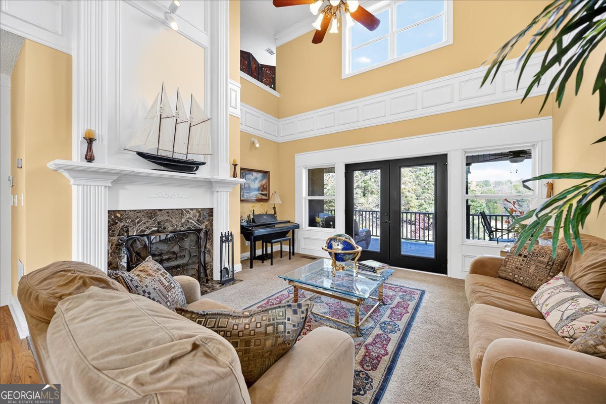 518 River Overlook Forsyth, GA 31029 - Photo 13 of 85 a living room with furniture fireplace and a large window