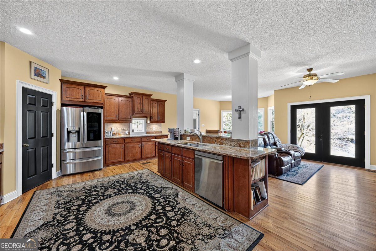 518 River Overlook Forsyth, GA 31029 - Photo 16 of 85 a kitchen with stainless steel appliances granite countertop a sink stove and refrigerator