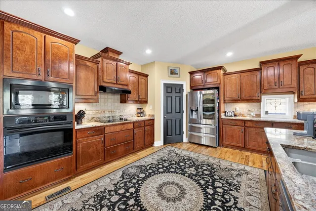 a bathroom with a toilet and a shower curtain