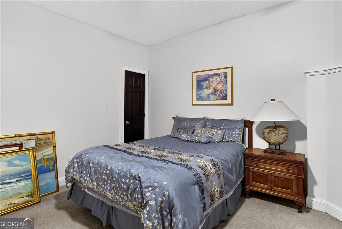 518 River Overlook Forsyth, GA 31029 - Photo 37 of 85 a bedroom with a bed and cabinet