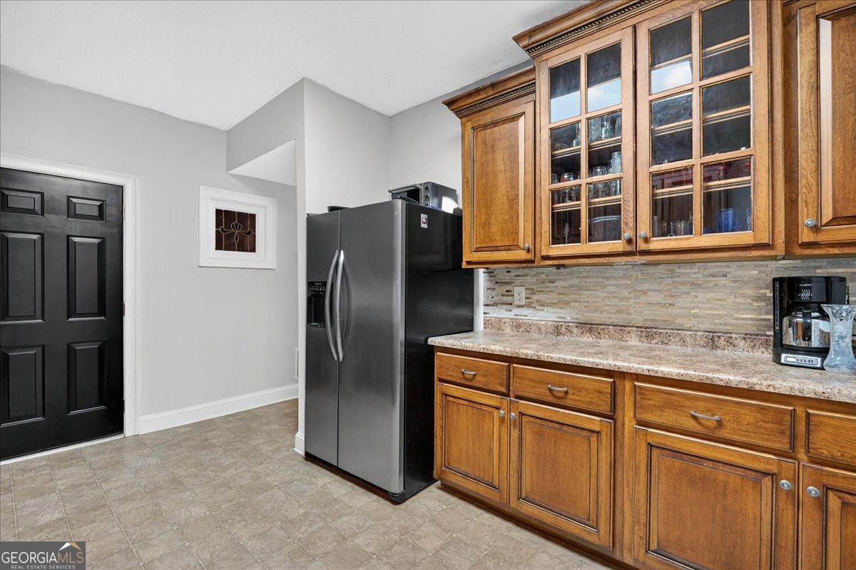 518 River Overlook Forsyth, GA 31029 - Photo 45 of 85 a kitchen with stainless steel appliances granite countertop a refrigerator and a sink