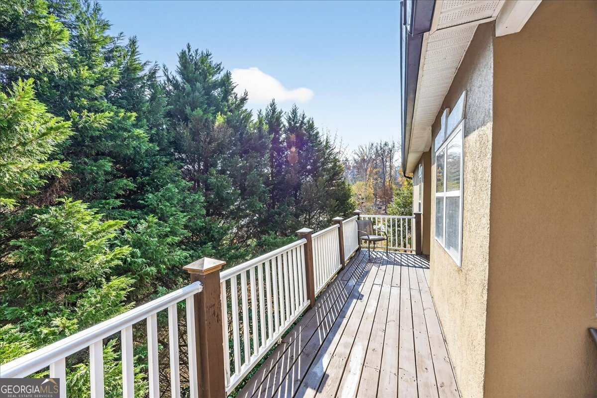 518 River Overlook Forsyth, GA 31029 - Photo 54 of 85 a view of a balcony with wooden floor and fence