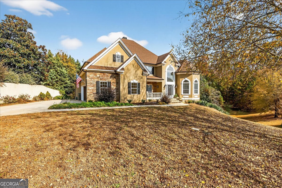 518 River Overlook Forsyth, GA 31029 - Photo 63 of 85 front view of a house with a yard