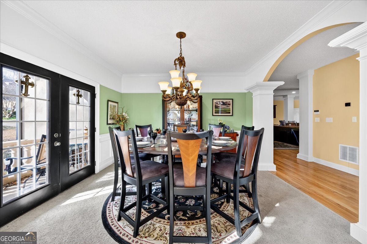 518 River Overlook Forsyth, GA 31029 - Photo 7 of 85 a view of a dining room with furniture window and wooden floor