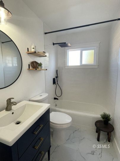 432 West Howell Avenue Ridgecrest, CA 93555 - Photo 19 of 28 a bathroom with a sink toilet and shower