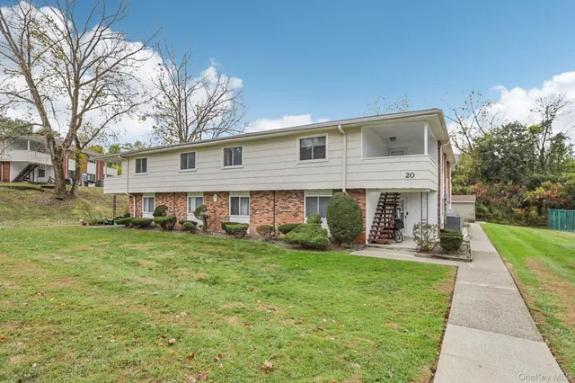 a view of a house with a yard porch and sitting area