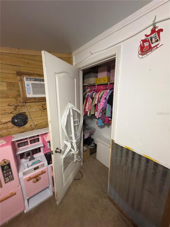 5500 South Chamberlain Pool Avenue Homosassa, FL 34448 - Photo 5 of 7 a bedroom with furniture and a window