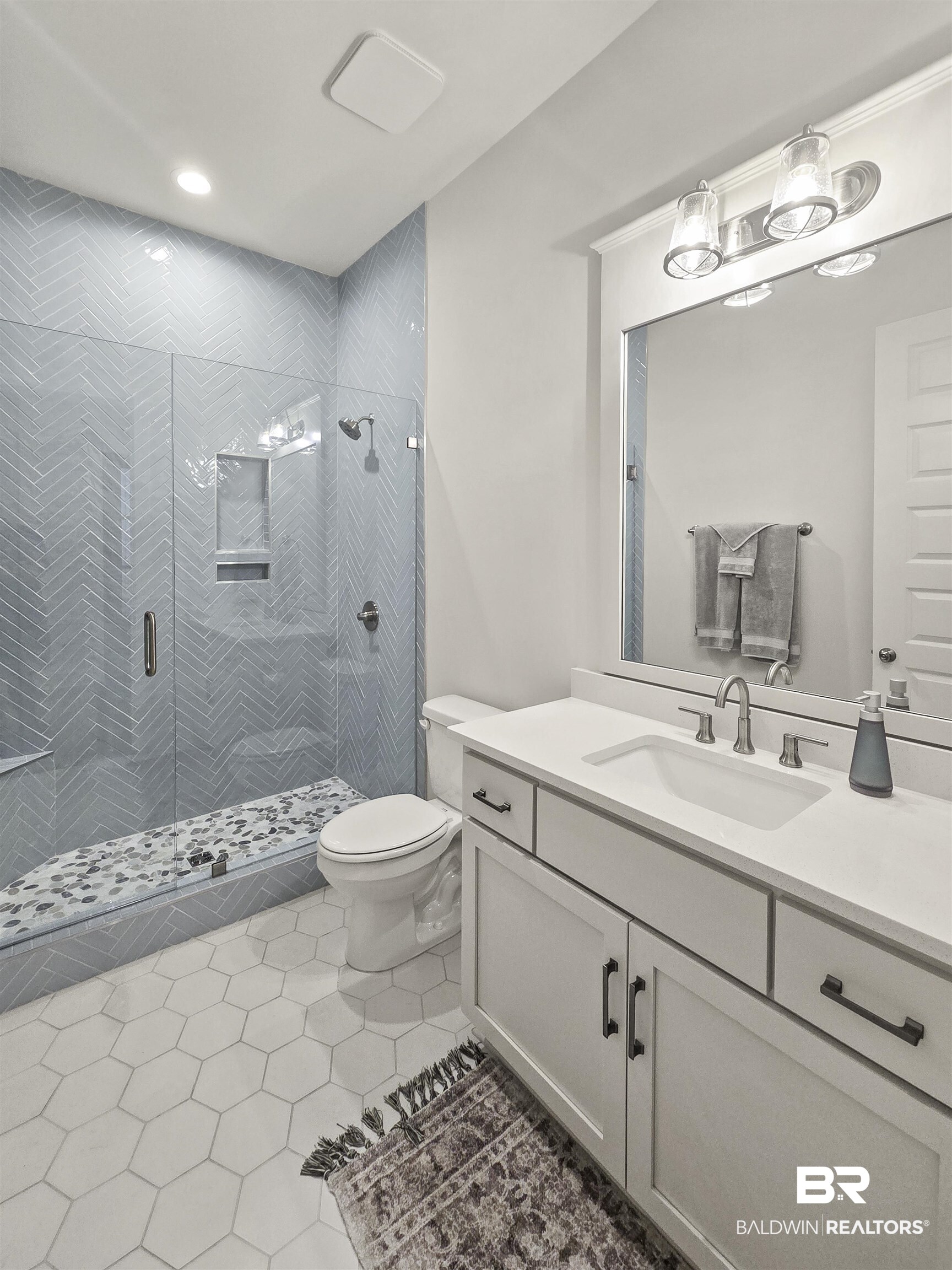 11258 Redfern Road Daphne, AL 36526 - Photo 34 of 44 Bathroom featuring a stall shower, vanity, light tile patterned floors, and recessed lighting