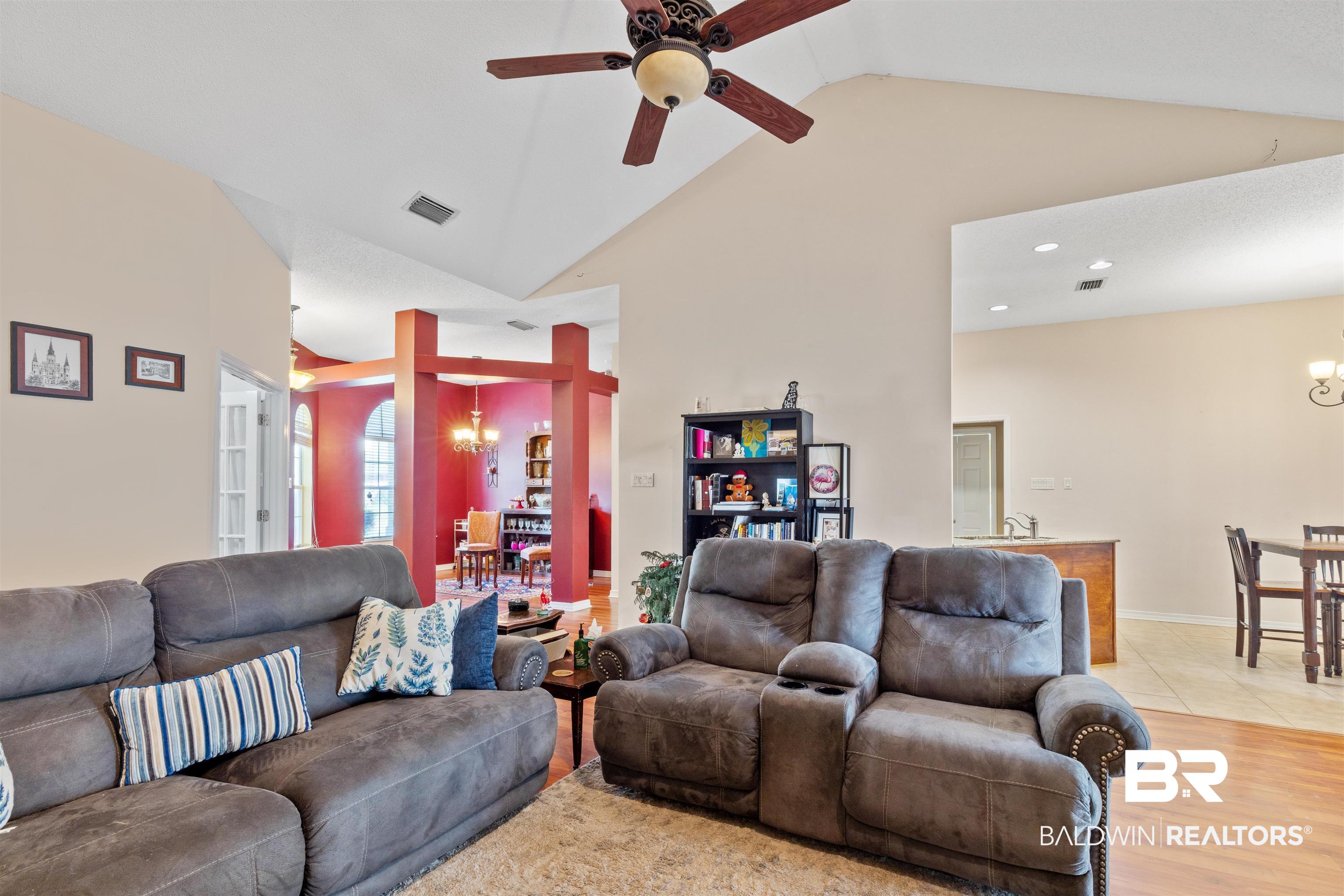 3075 Azalea Trace Drive Mobile, AL 36695 - Photo 12 of 33 Living area with high vaulted ceiling, ceiling fan with notable chandelier, light wood-style flooring, visible vents, and recessed lighting