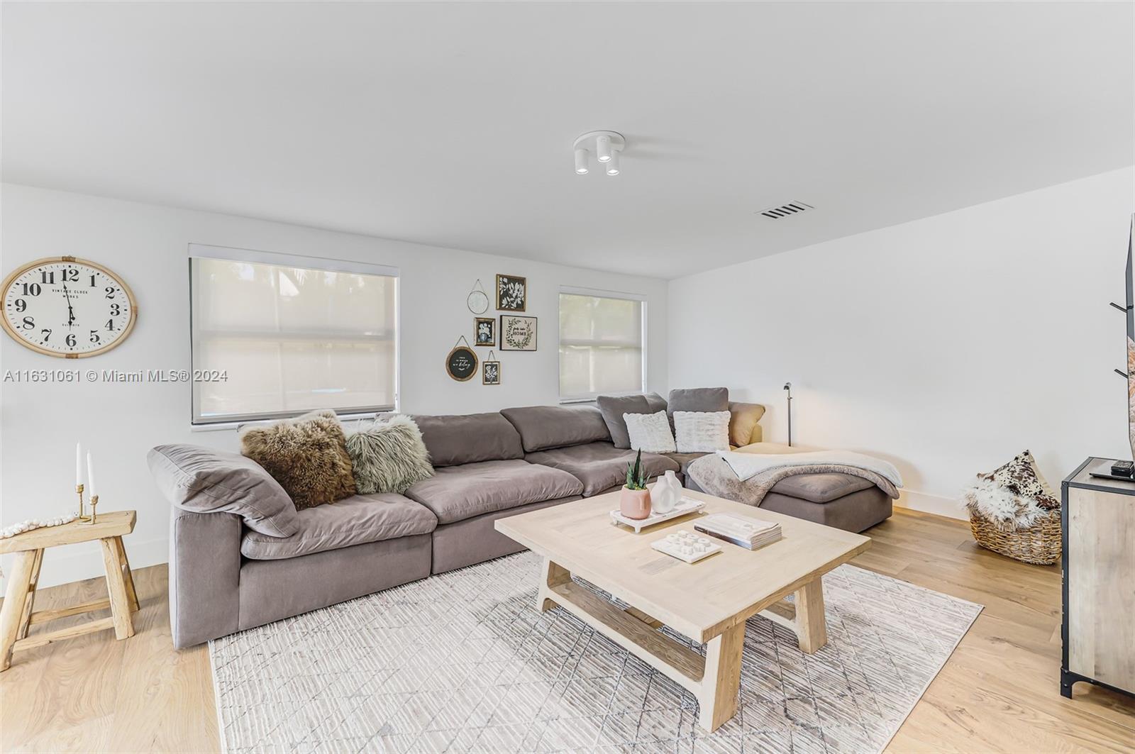10900 Southwest 128th Street Miami, FL 33186 - Photo 31 of 34 a living room with furniture a rug and a large window