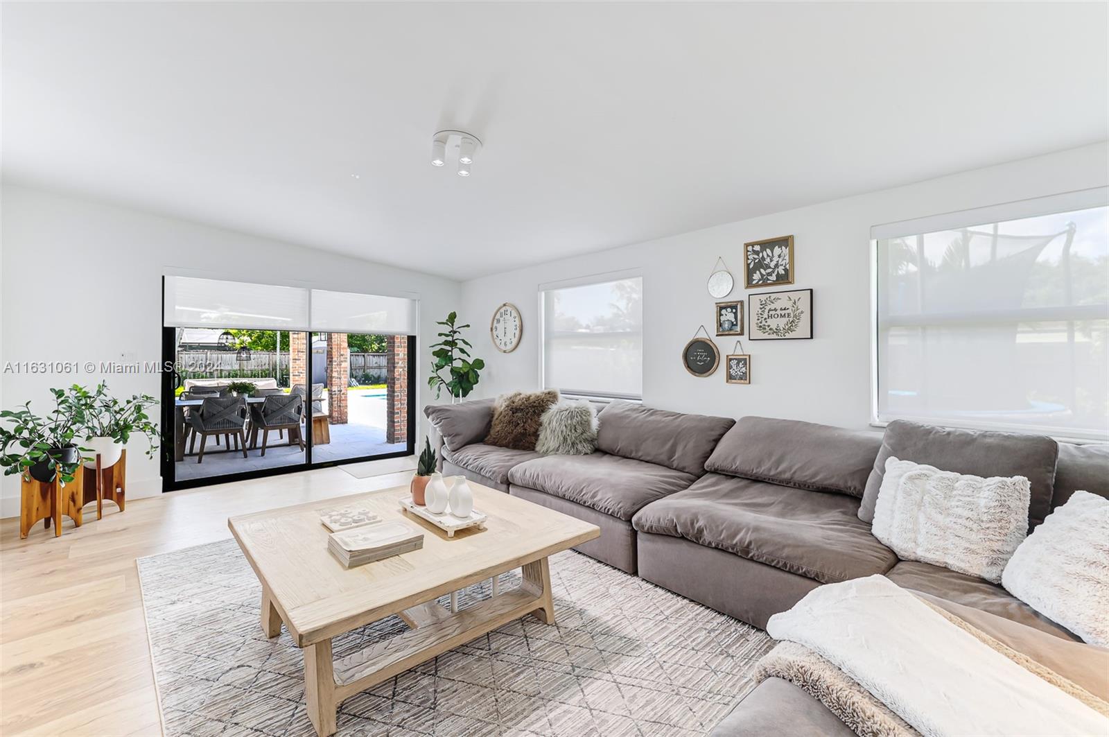 10900 Southwest 128th Street Miami, FL 33186 - Photo 32 of 34 a living room with furniture and a large window
