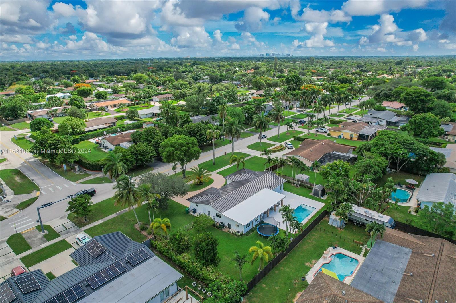 10900 Southwest 128th Street Miami, FL 33186 - Photo 6 of 34 an aerial view of a house with a garden