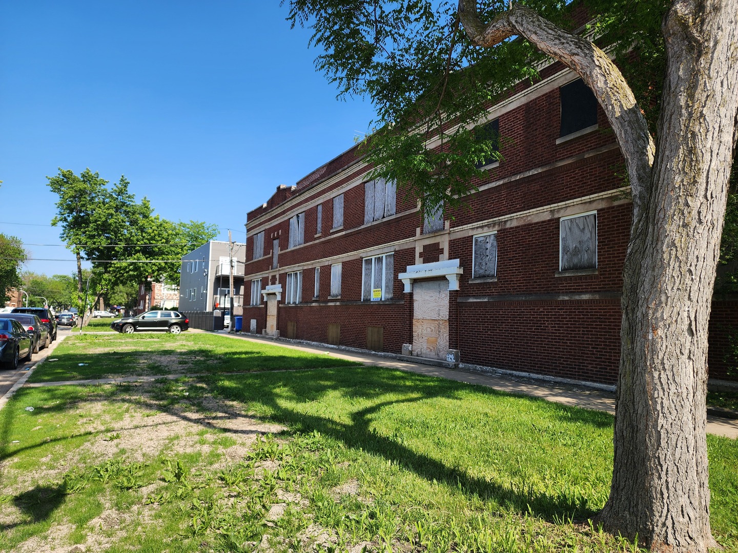 4921 West Maypole Avenue Chicago, IL 60644 - Photo 1 of 3 a backyard of a house with lots of green space