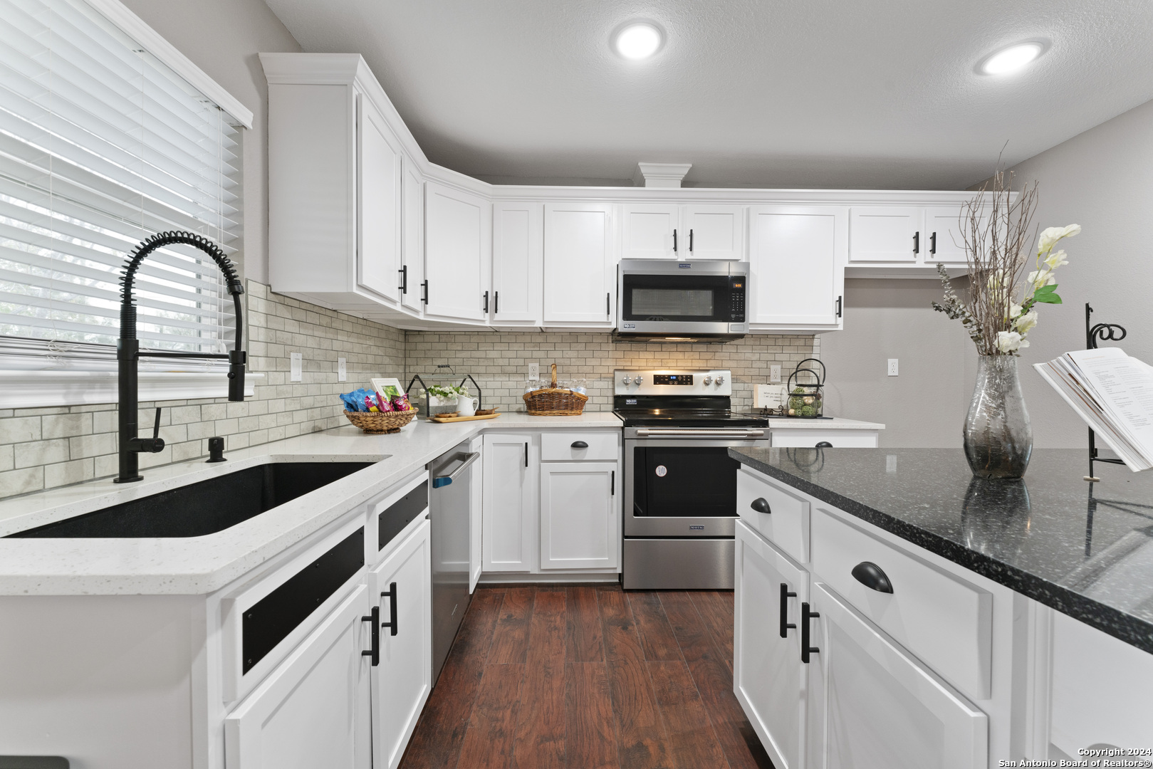 102 West Cr 5719 Devine, TX 78016 - Photo 1 of 32 a kitchen with stainless steel appliances granite countertop a sink and cabinets