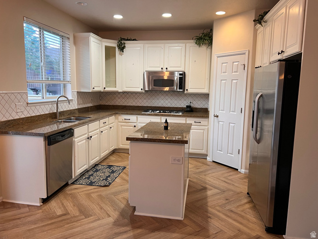 2001 Fielding Hill Lane Draper, UT 84020 - Photo 7 of 21 Kitchen with stainless steel appliances, white cabinetry, dark stone countertops, and recessed lighting