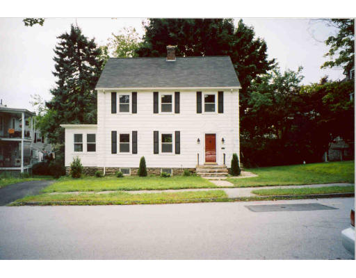 43 Hadwen Road Worcester, MA 01602 - Photo 3 of 16 a view of a white house with a big yard and a large trees