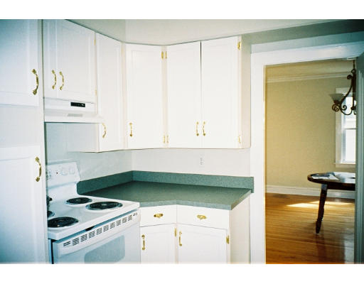 43 Hadwen Road Worcester, MA 01602 - Photo 7 of 16 a kitchen with a stove a refrigerator and cabinets