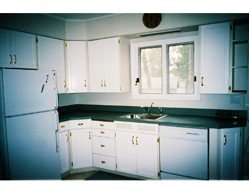 43 Hadwen Road Worcester, MA 01602 - Photo 8 of 16 a kitchen with granite countertop white cabinets and white appliances