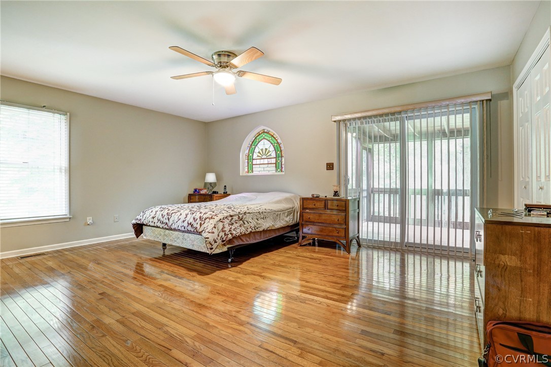 2511 Fairground Road Maidens, VA 23102 - Photo 17 of 29 a bedroom with a bed and wooden floor