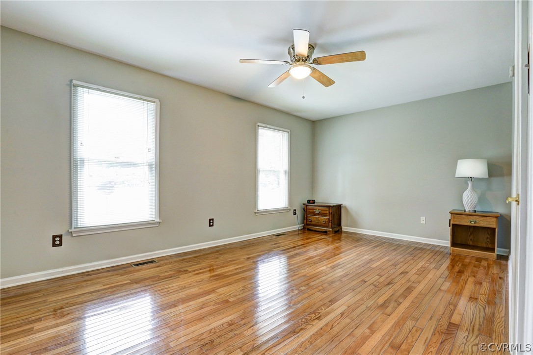 2511 Fairground Road Maidens, VA 23102 - Photo 20 of 29 a view of an empty room with wooden floor and a window