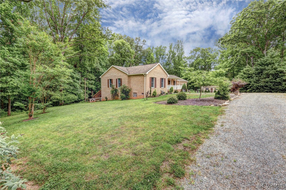 2511 Fairground Road Maidens, VA 23102 - Photo 2 of 29 a view of a house with a yard and large trees