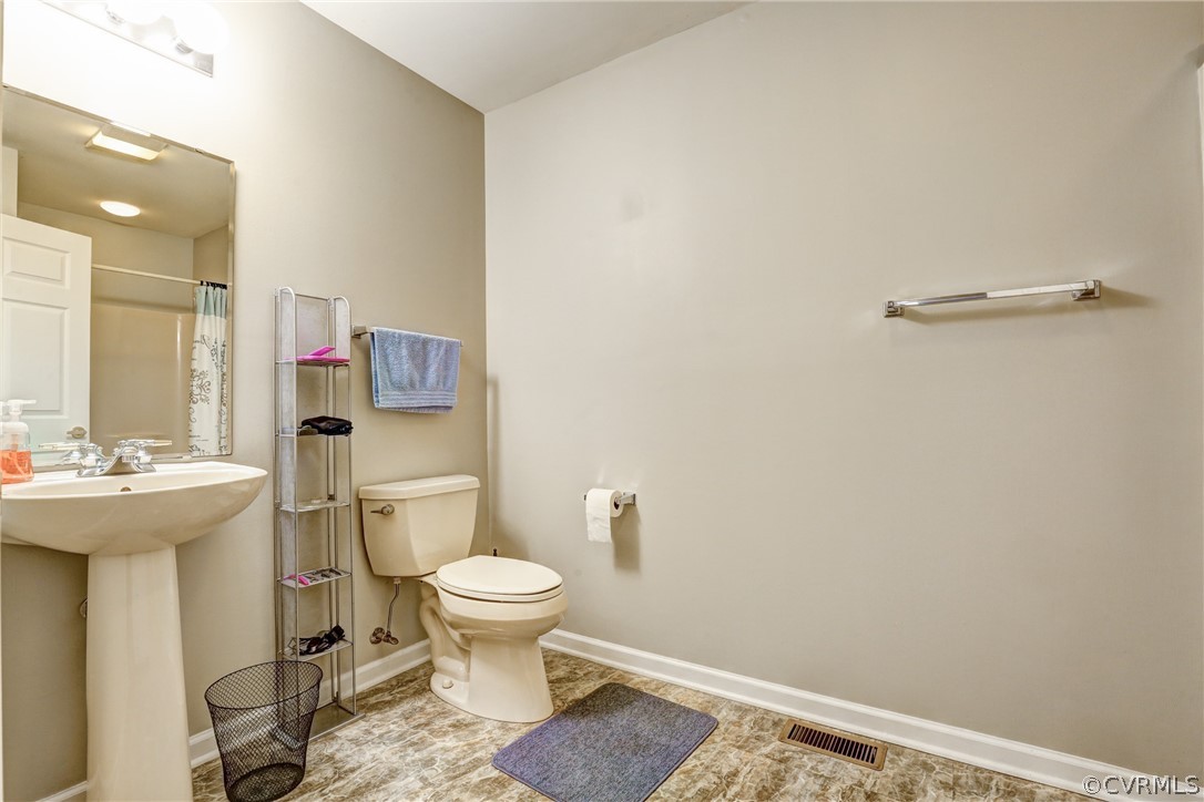2511 Fairground Road Maidens, VA 23102 - Photo 22 of 29 a bathroom with a sink toilet and shower