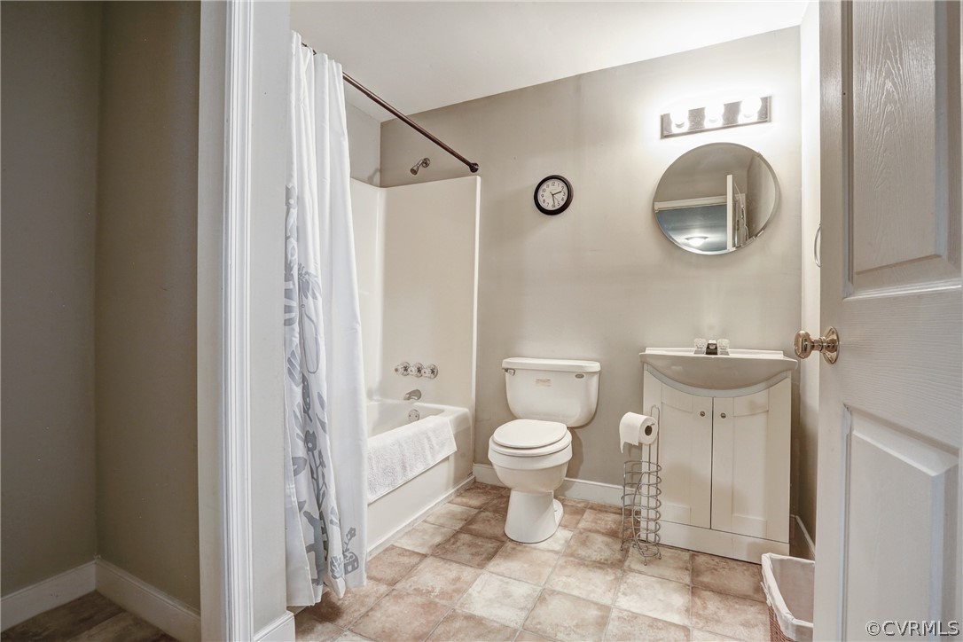 2511 Fairground Road Maidens, VA 23102 - Photo 25 of 29 a white toilet sitting next to a bathroom sink