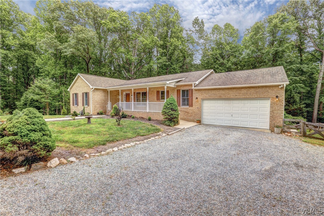 2511 Fairground Road Maidens, VA 23102 - Photo 4 of 29 front view of a house with a yard and potted plants