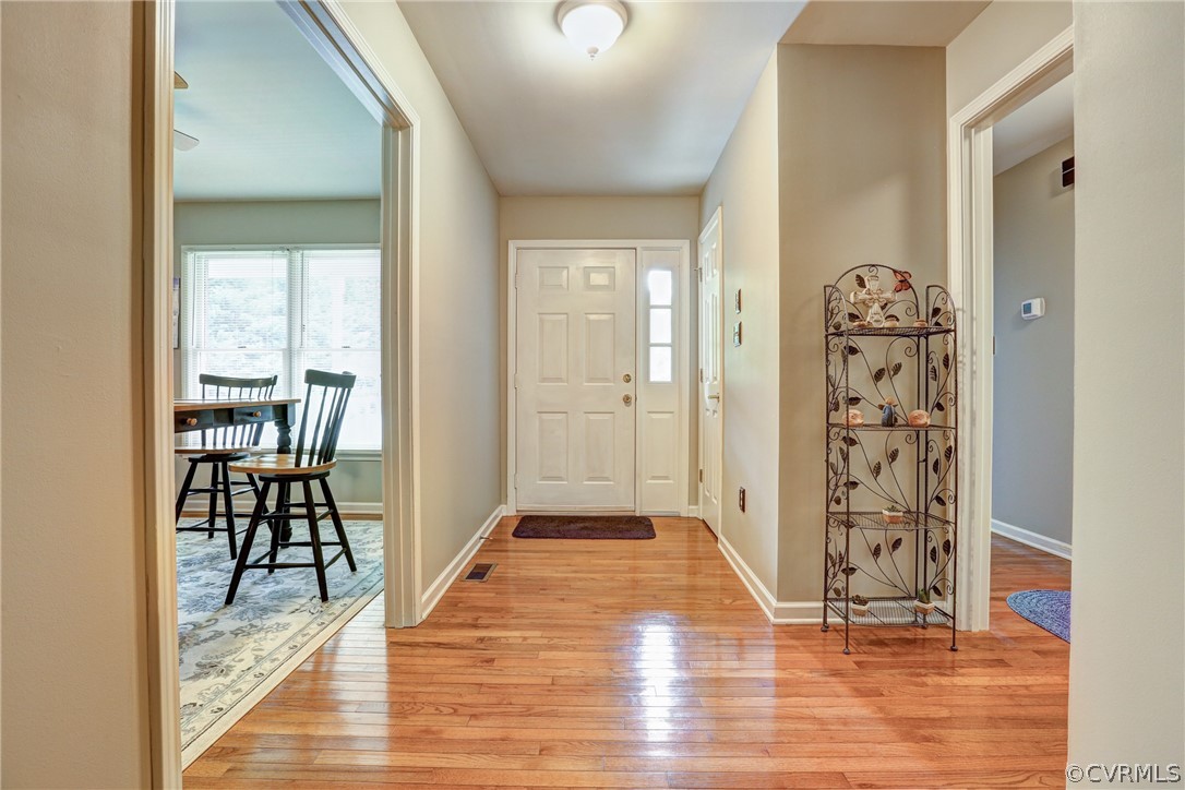 2511 Fairground Road Maidens, VA 23102 - Photo 8 of 29 a view of a hallway with wooden floor windows and a livingroom view