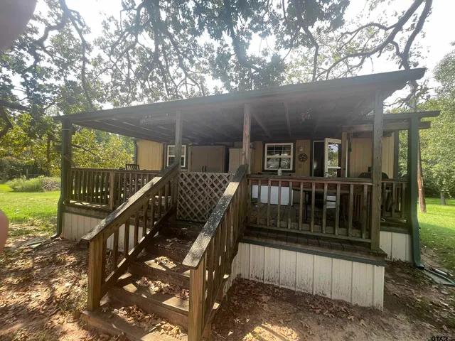 a view of balcony with wooden floor