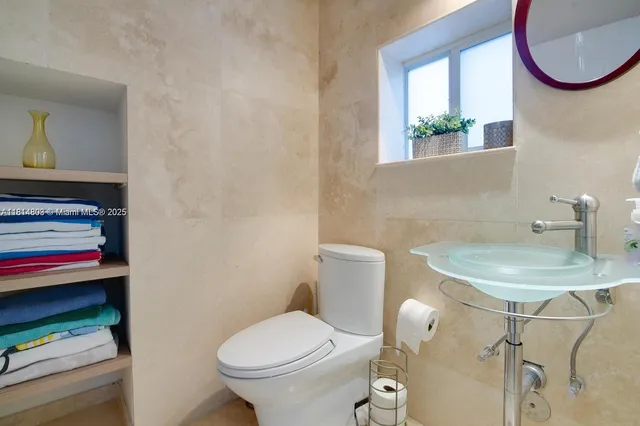 a bathroom with a sink and mirror