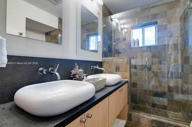 a bathroom with a shower and toilet