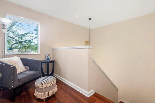 a view of a living room and wooden floor