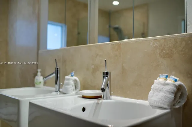a bathroom with a sink and a mirror