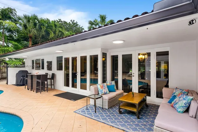 a picture of a bathroom with a white wall