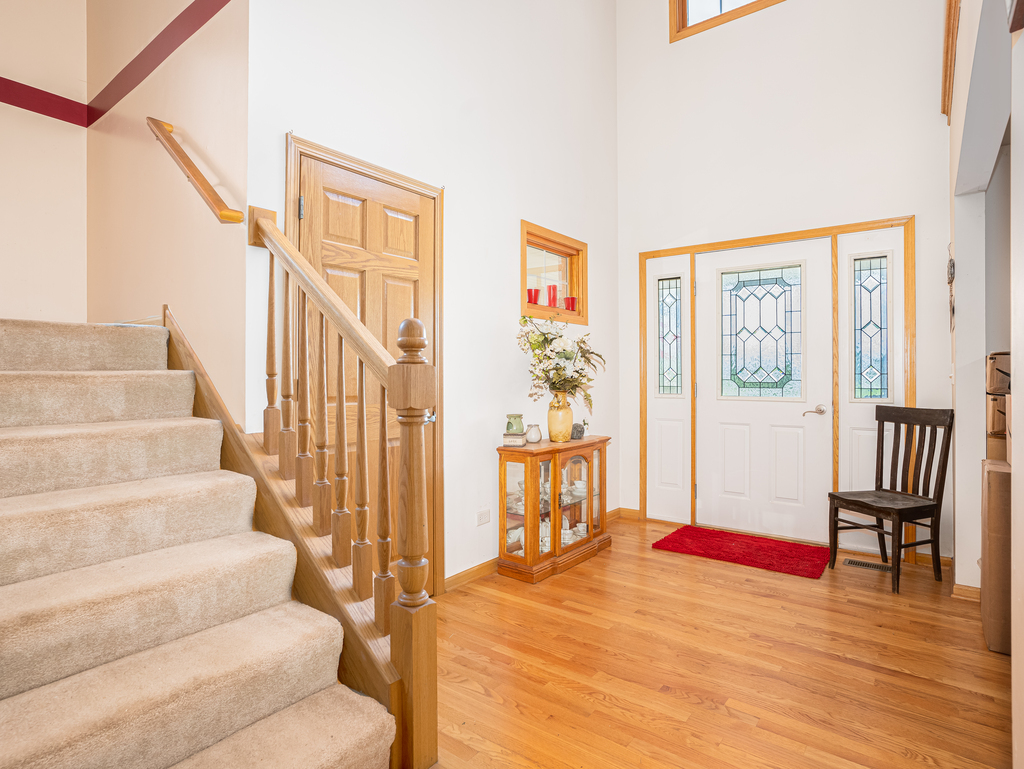 25509 South Chicago Road Elwood, IL 60421 - Photo 19 of 47 a view of staircase and living room with wooden floor