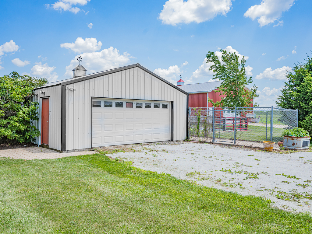 25509 South Chicago Road Elwood, IL 60421 - Photo 6 of 47 a front view of a house with a yard and garage