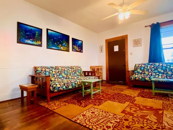 a bed room with a bed and a chair