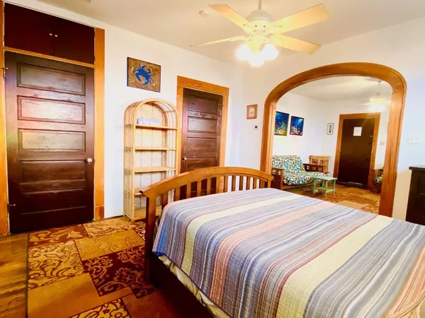 a bedroom with a bed and a dresser