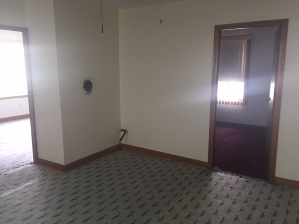 650 Third Street Fall River, MA 02721 - Photo 10 of 30 an empty room with wooden floor and windows