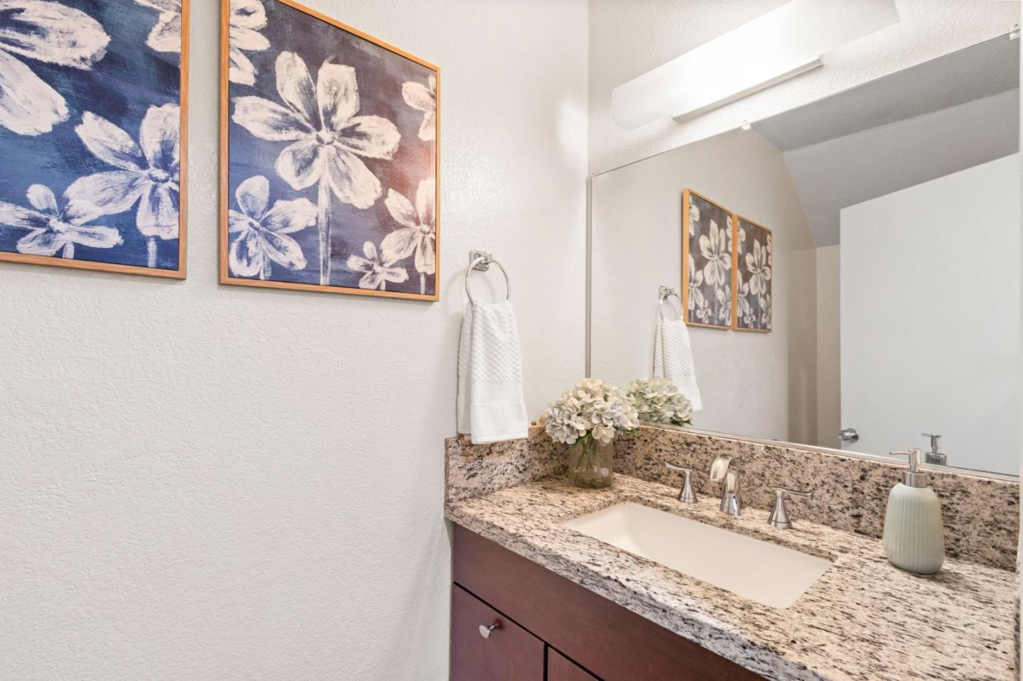 643 Foster Court, Unit 4 Hayward, CA 94544 - Photo 15 of 20 a bathroom with a granite countertop sink and a mirror