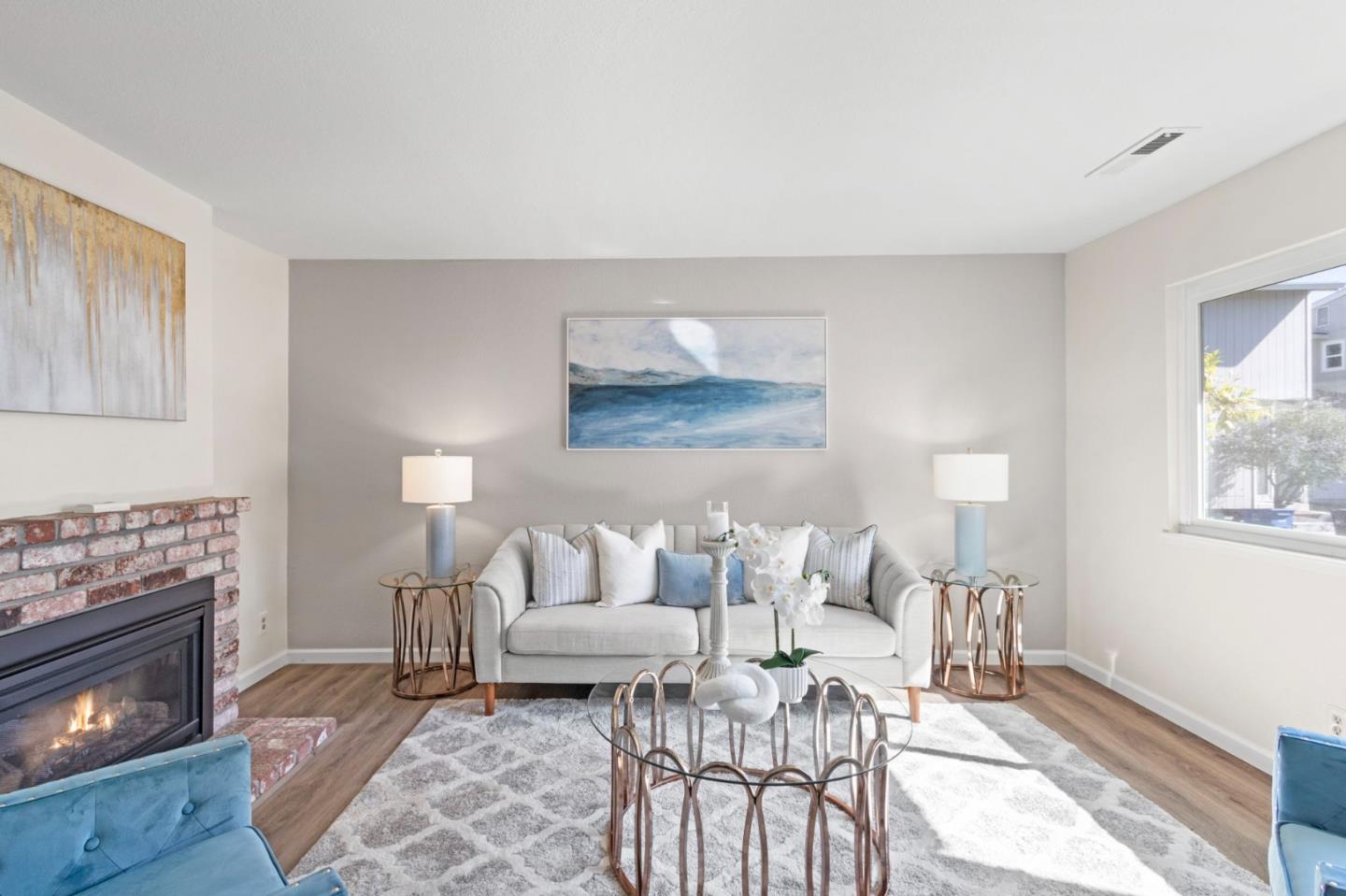 643 Foster Court, Unit 4 Hayward, CA 94544 - Photo 3 of 20 a living room with furniture and a fireplace